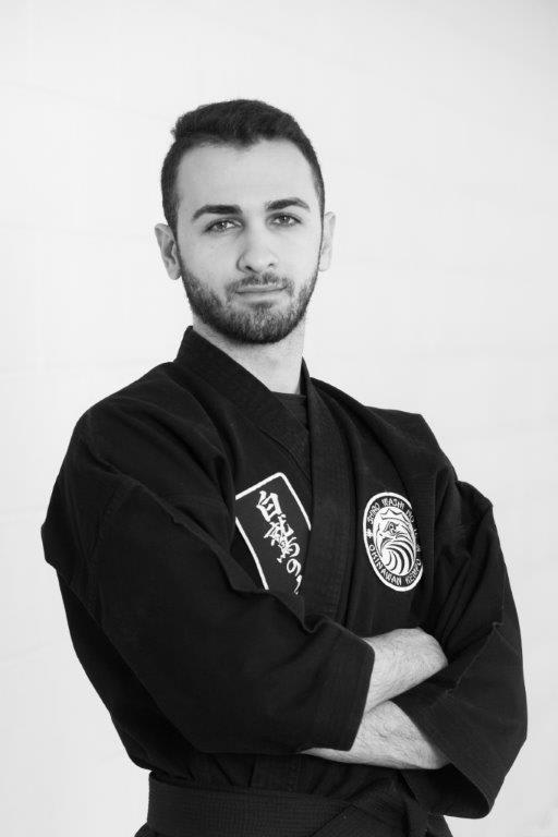 Instructor Mohammed Ali Alkazemi in martial arts uniform, showcasing expertise at Polander Academy of Martial Arts in Bethesda.